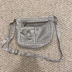 Distressed light grey crossbody bag with lots of pockets. Dark gold detailing.